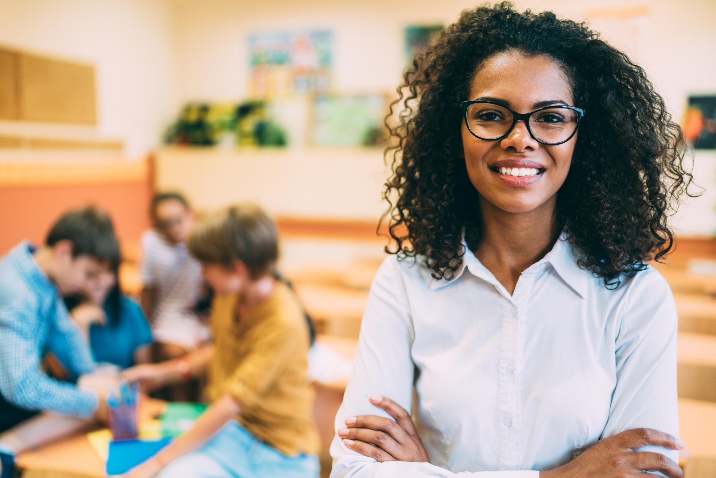 Portrait of smiling teacher in class